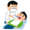 診療する男性歯科医師