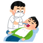 診療する男性歯科医師
