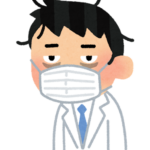 過労気味の白衣の男性