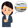 電車の遅延を心配する女性会社員