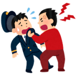 駅員の胸ぐらをつかむ男性